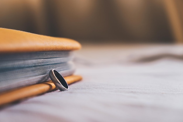 A close-up of a gavel resting on a stack of papers with the words 