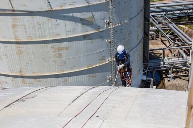 A close-up of construction workers pouring concrete on a bridge deck. Heavy machinery is visible in the background, and the workers are wearing safety gear.