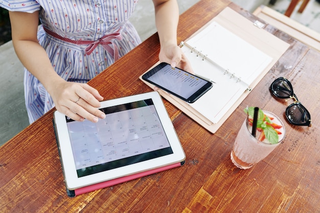 A person using time-blocking techniques on a digital planner, allocating specific time slots for learning and other activities.