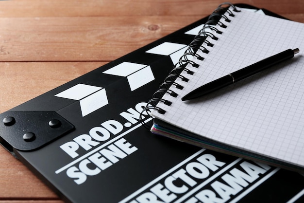 A close-up studio shot of a stack of film scripts, representing the various acting roles and the potential earnings associated with each project.