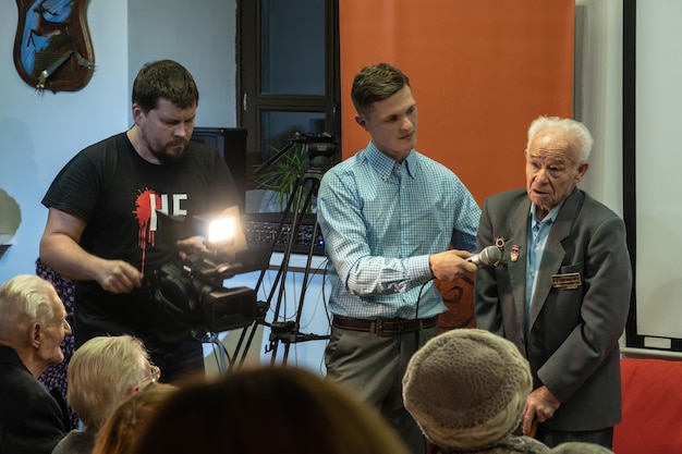Behind-the-scenes photo of a director giving instructions on set, showcasing the intense pressure and collaborative environment of TV production.